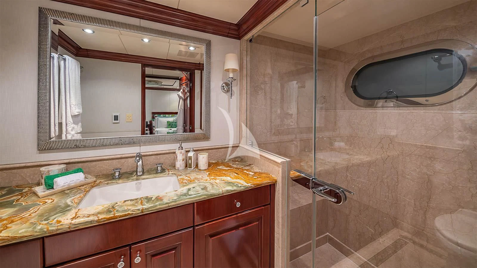 a bathroom with a large mirror aboard CARTE BLANCHE Yacht for Charter