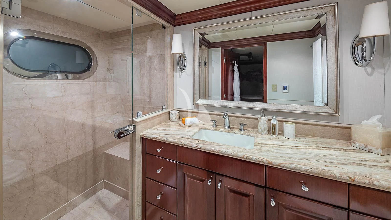 a bathroom with a large mirror aboard CARTE BLANCHE Yacht for Charter