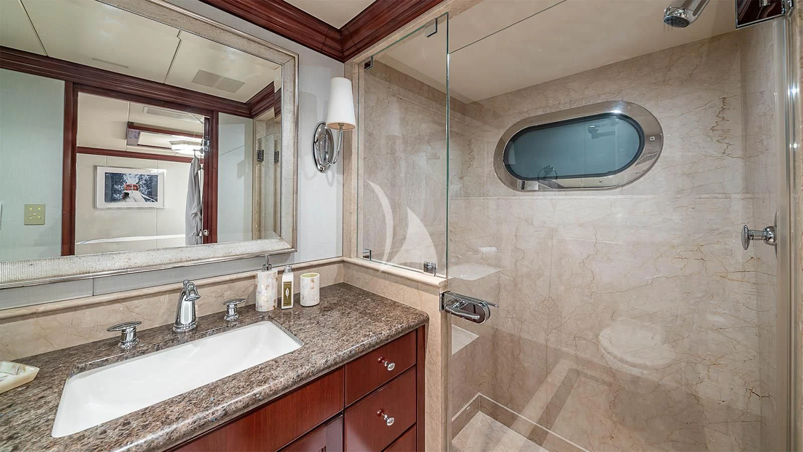 a bathroom with a large mirror aboard CARTE BLANCHE Yacht for Charter
