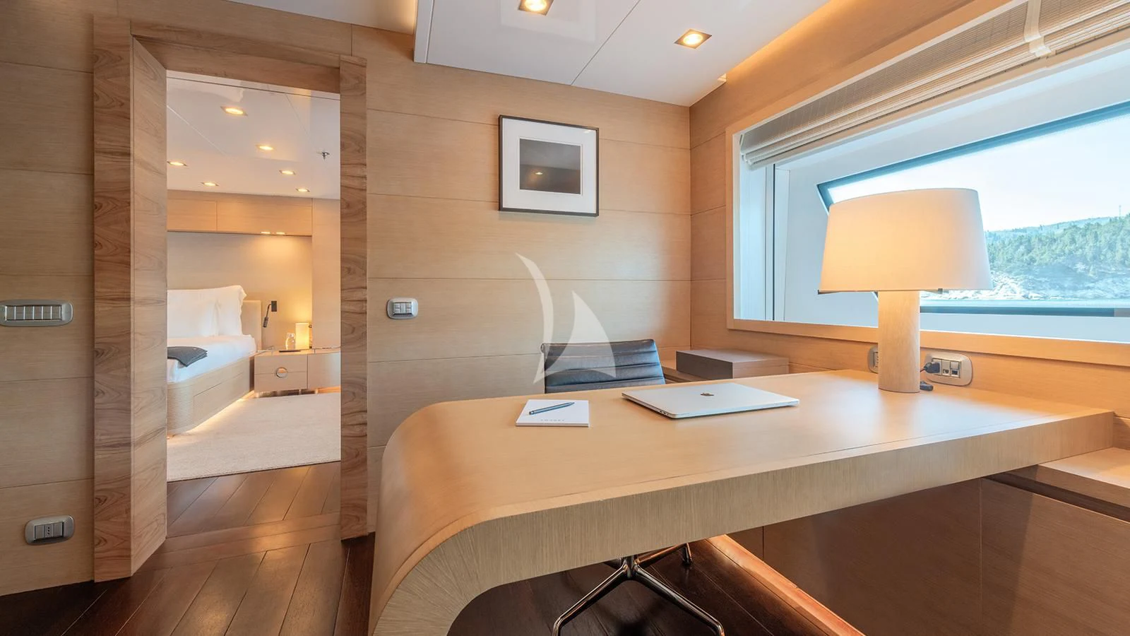 a room with a desk and a lamp aboard ZIA Yacht for Sale