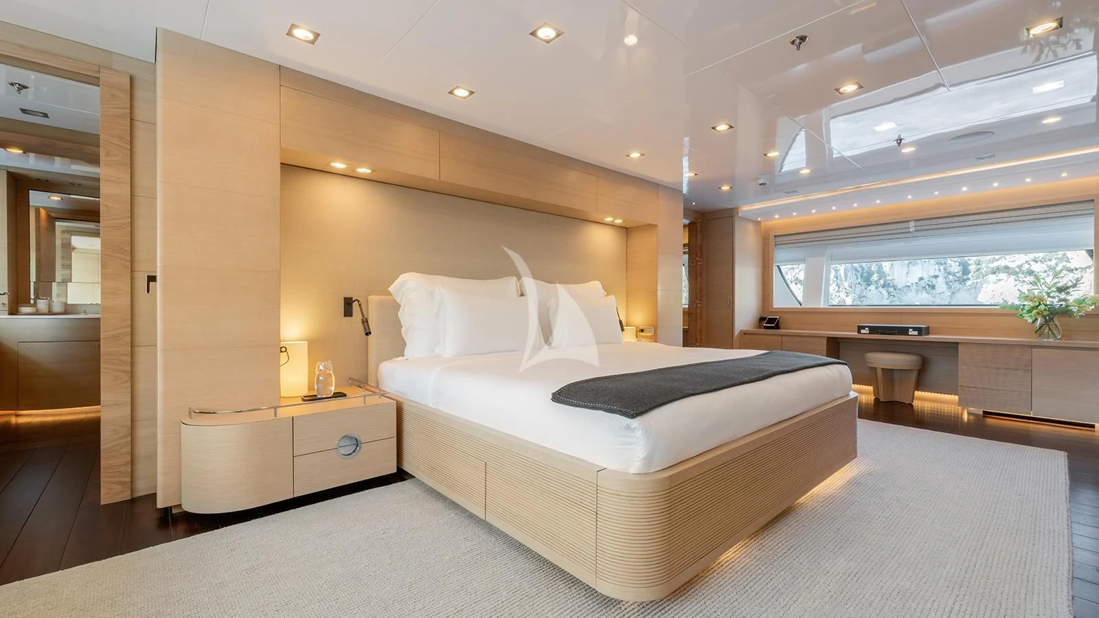 a large bedroom with a large bed aboard ZIA Yacht for Sale