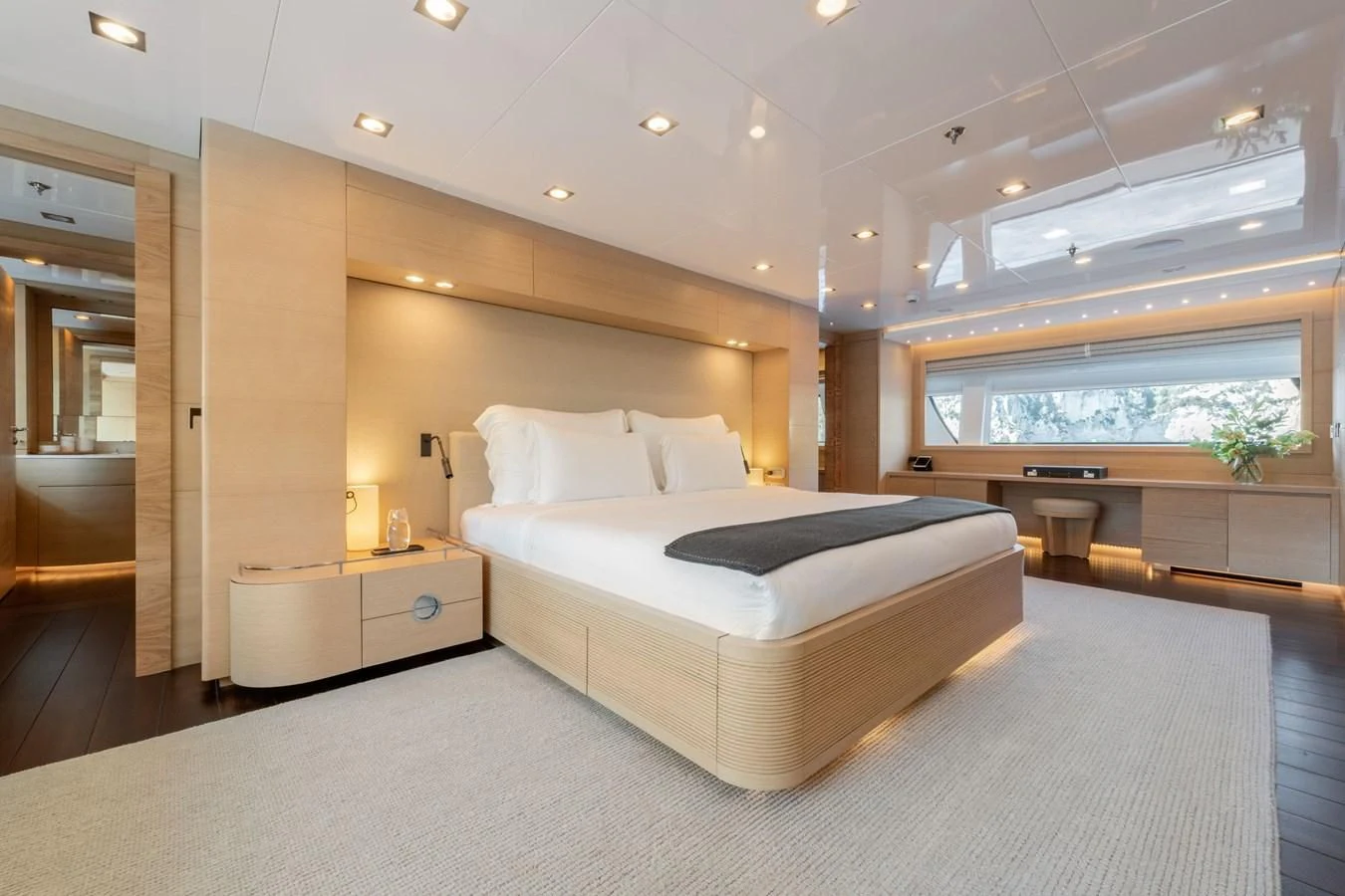 a large bedroom with a large bed aboard ZIA Yacht for Sale