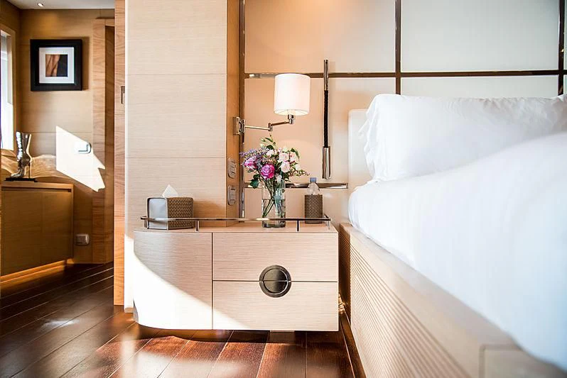 a room with a bed and a desk aboard ZIA Yacht for Sale