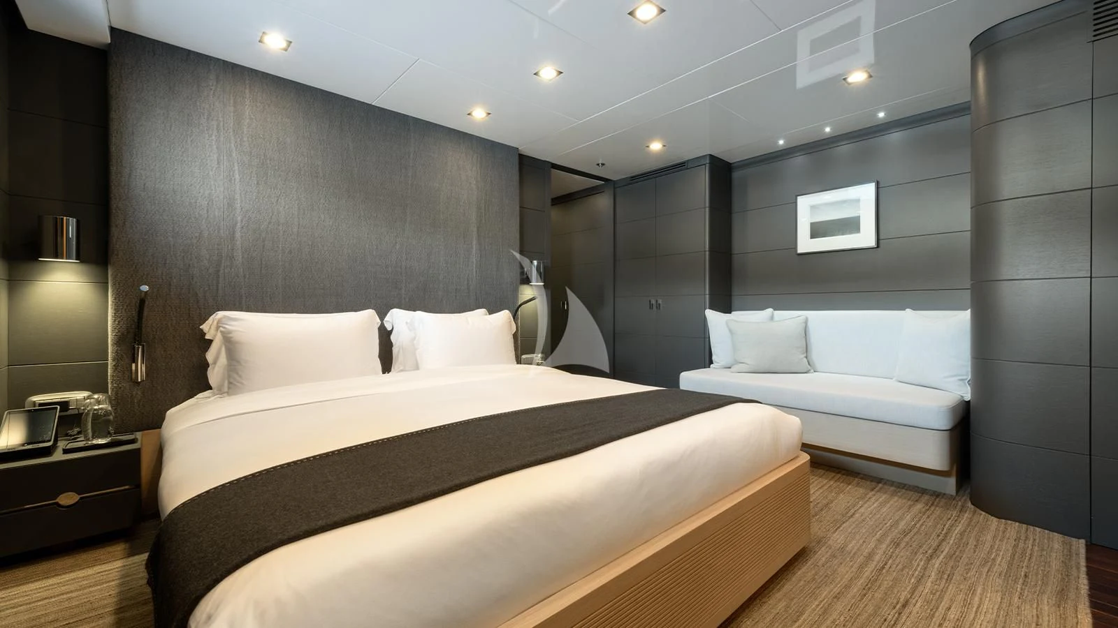 a room with a bed and a couch aboard ZIA Yacht for Sale