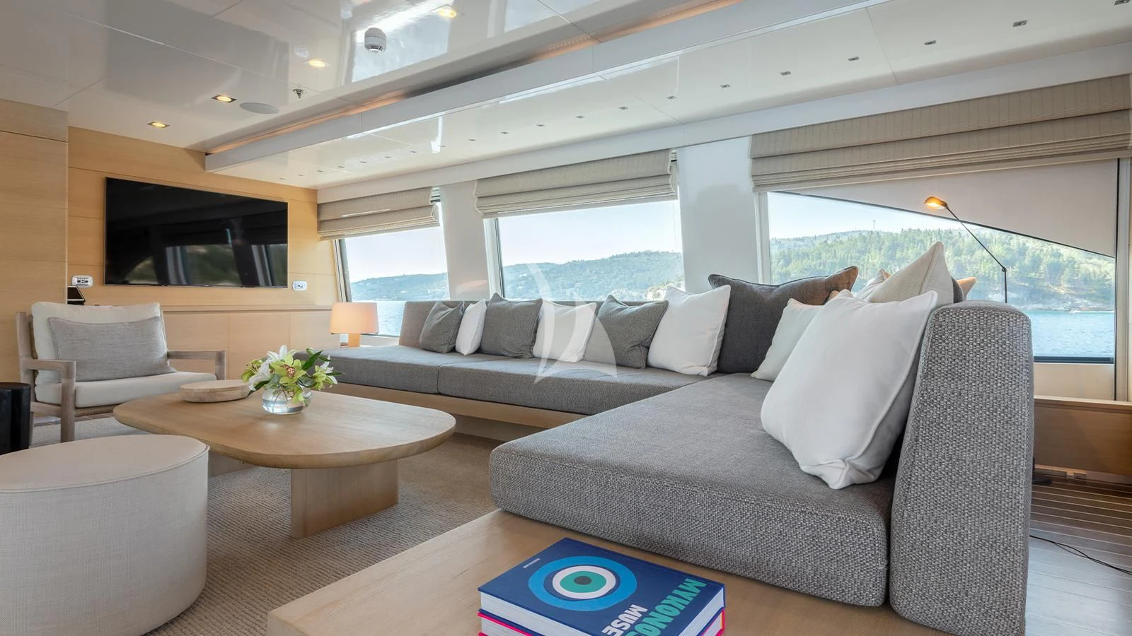 a living room with a couch and a table aboard ZIA Yacht for Sale