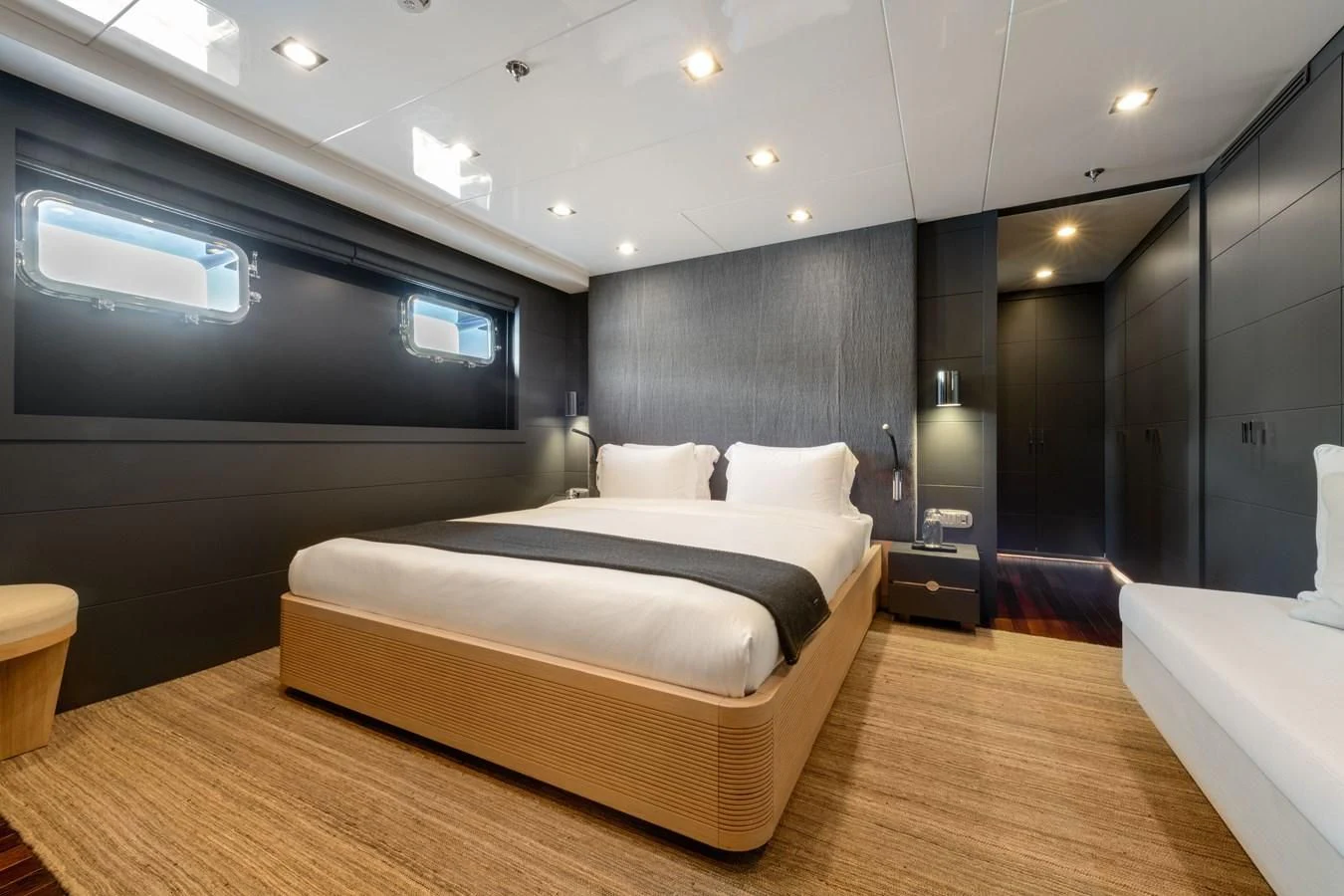 a large bedroom with a large bed aboard ZIA Yacht for Sale