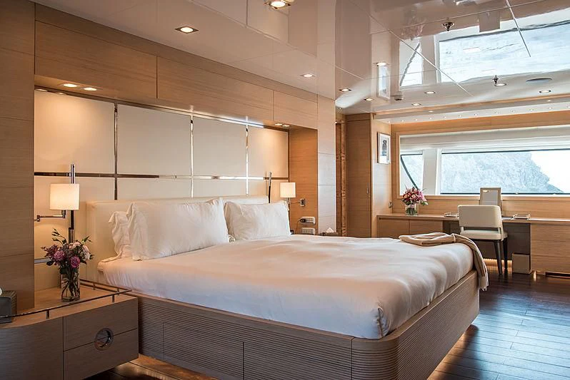a large bed in a room aboard ZIA Yacht for Sale