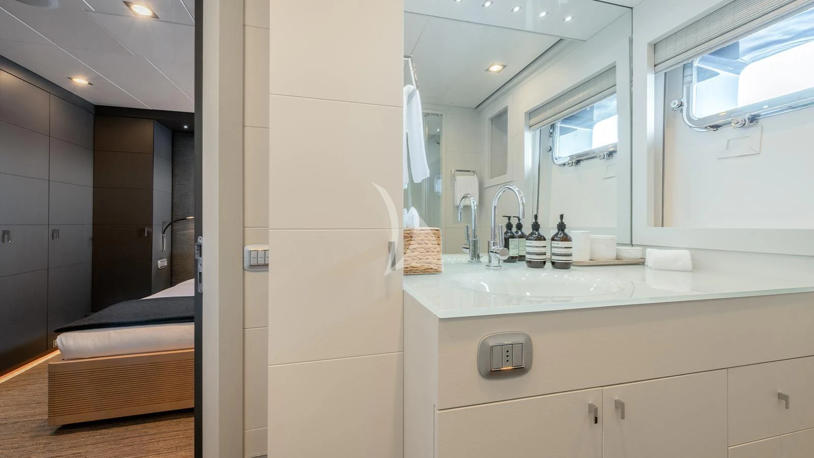 a bathroom with a large mirror aboard ZIA Yacht for Sale