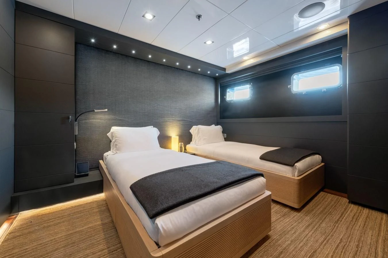 a room with a bed and a large mirror aboard ZIA Yacht for Sale