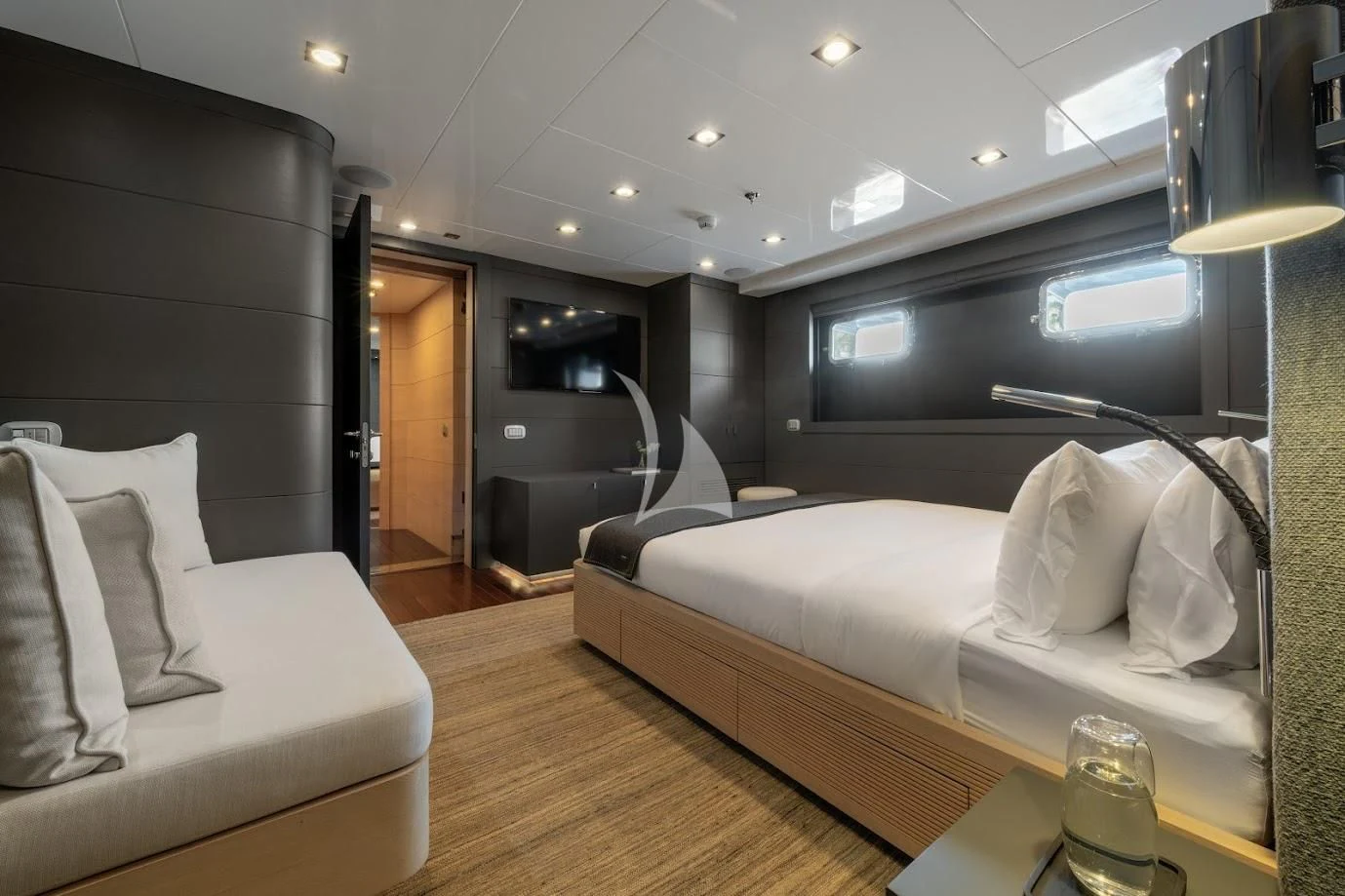 a room with a bed and a couch aboard ZIA Yacht for Sale