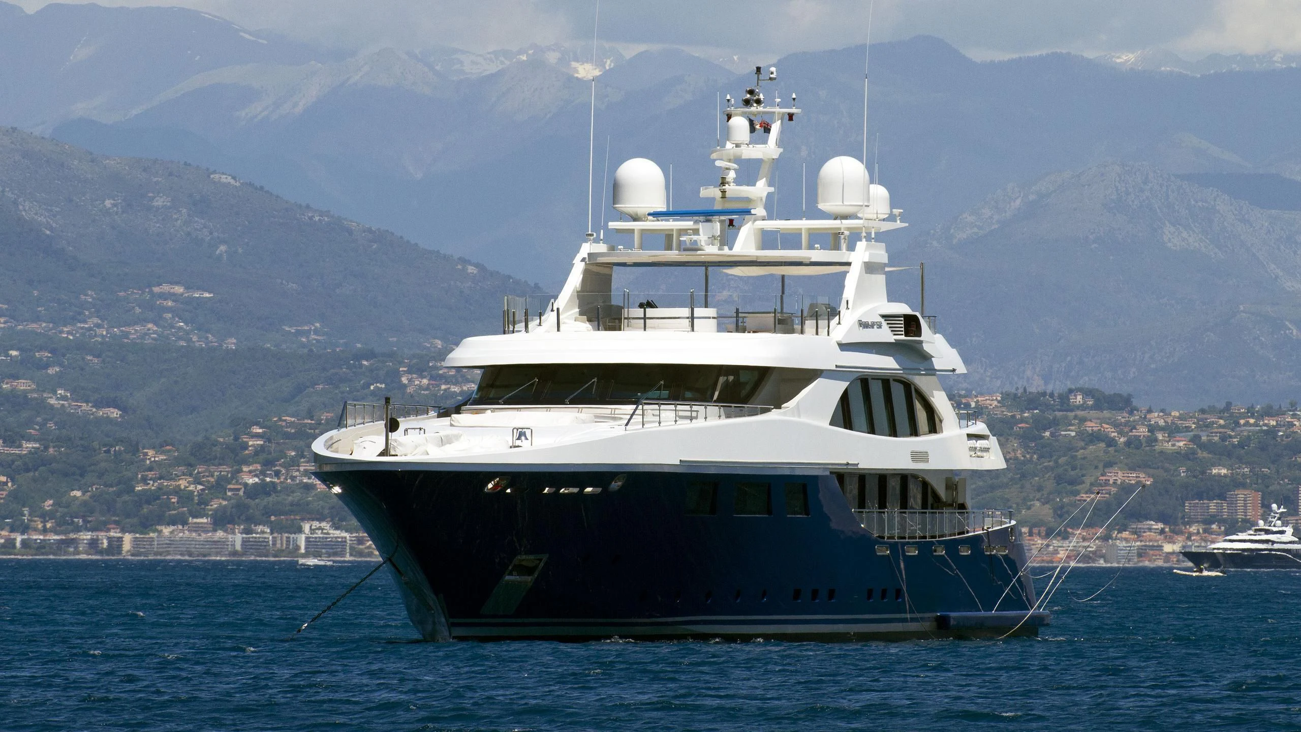 a large white boat in the water aboard ZIA Yacht for Sale