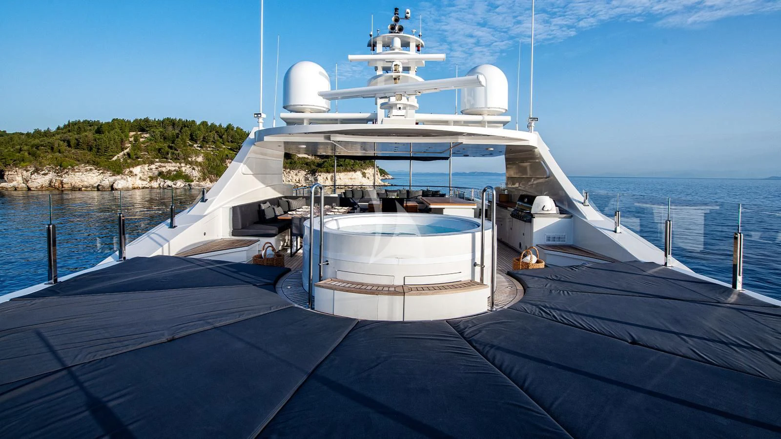 a large white boat on a dock aboard ZIA Yacht for Sale