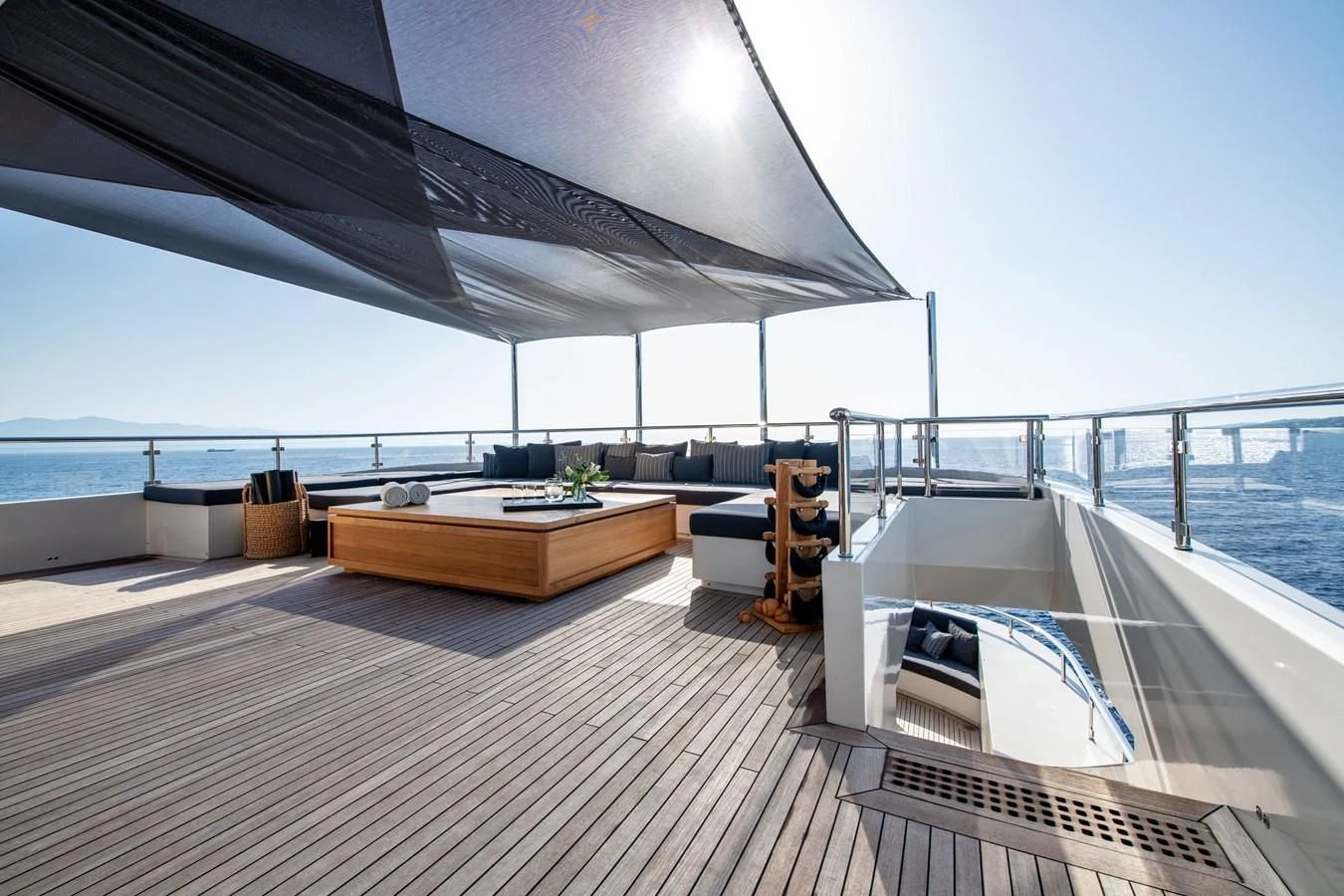 a deck with a large deck overlooking the ocean aboard ZIA Yacht for Sale