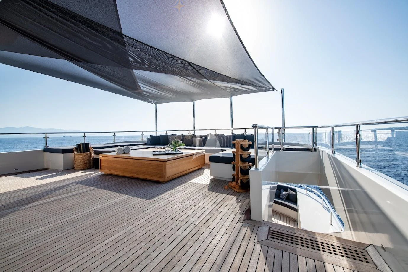 a deck with a large umbrella aboard ZIA Yacht for Sale