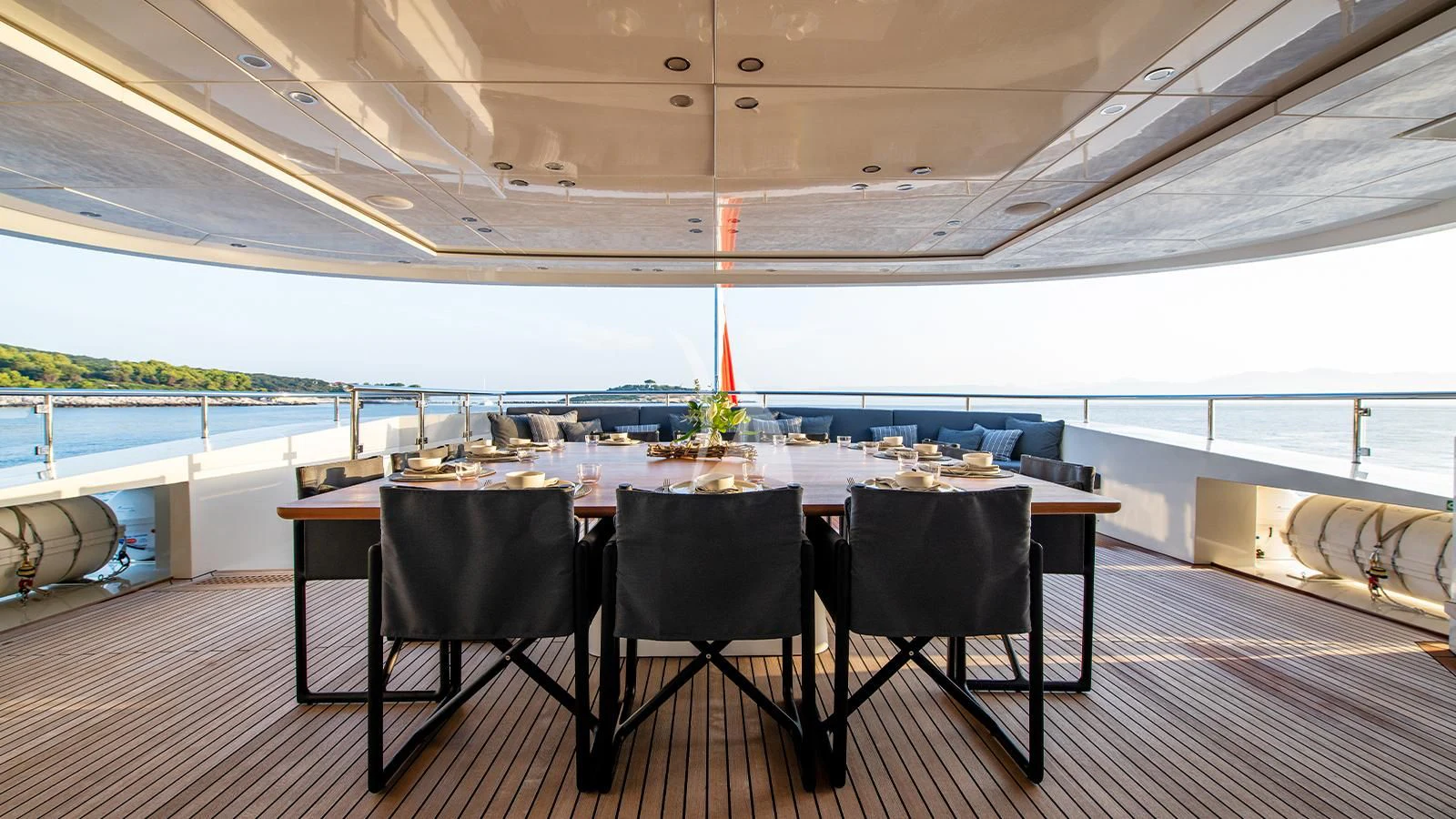 a table with chairs around it aboard ZIA Yacht for Sale