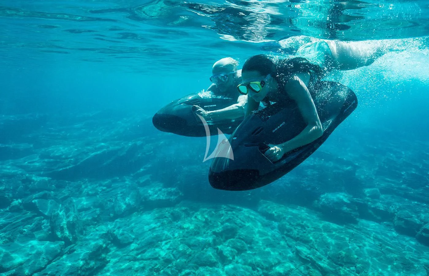 a man and a woman in the water aboard ZIA Yacht for Sale