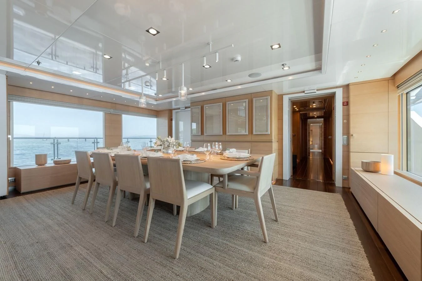 a large kitchen with a table and chairs aboard ZIA Yacht for Sale