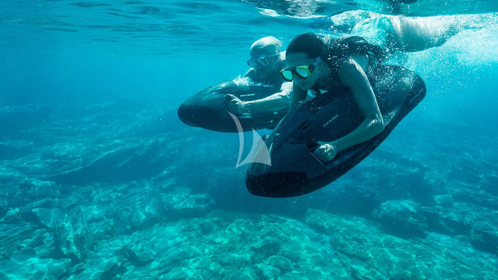 a man and a woman in the water aboard ZIA Yacht for Sale