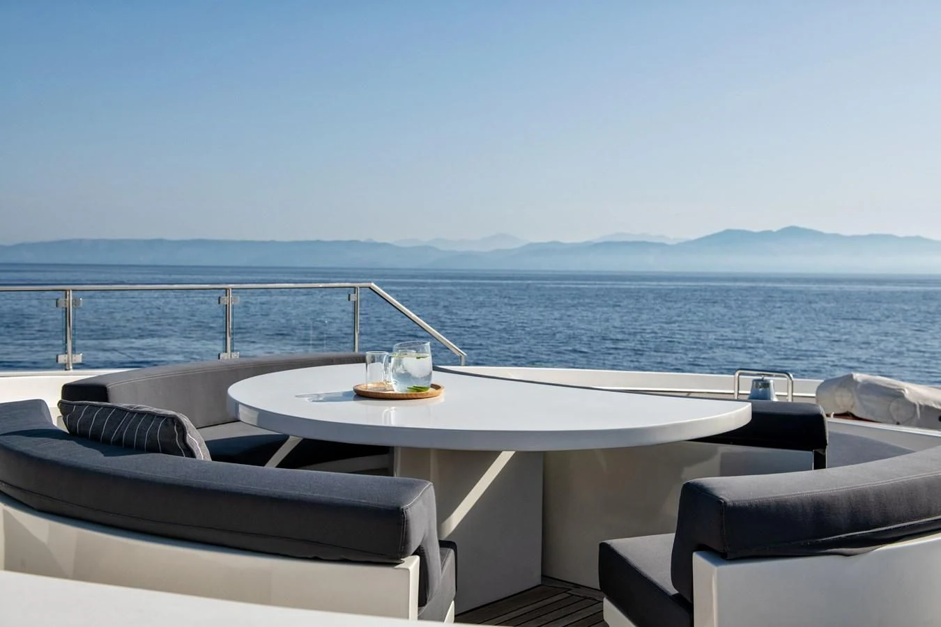a table and chairs on a boat aboard ZIA Yacht for Sale