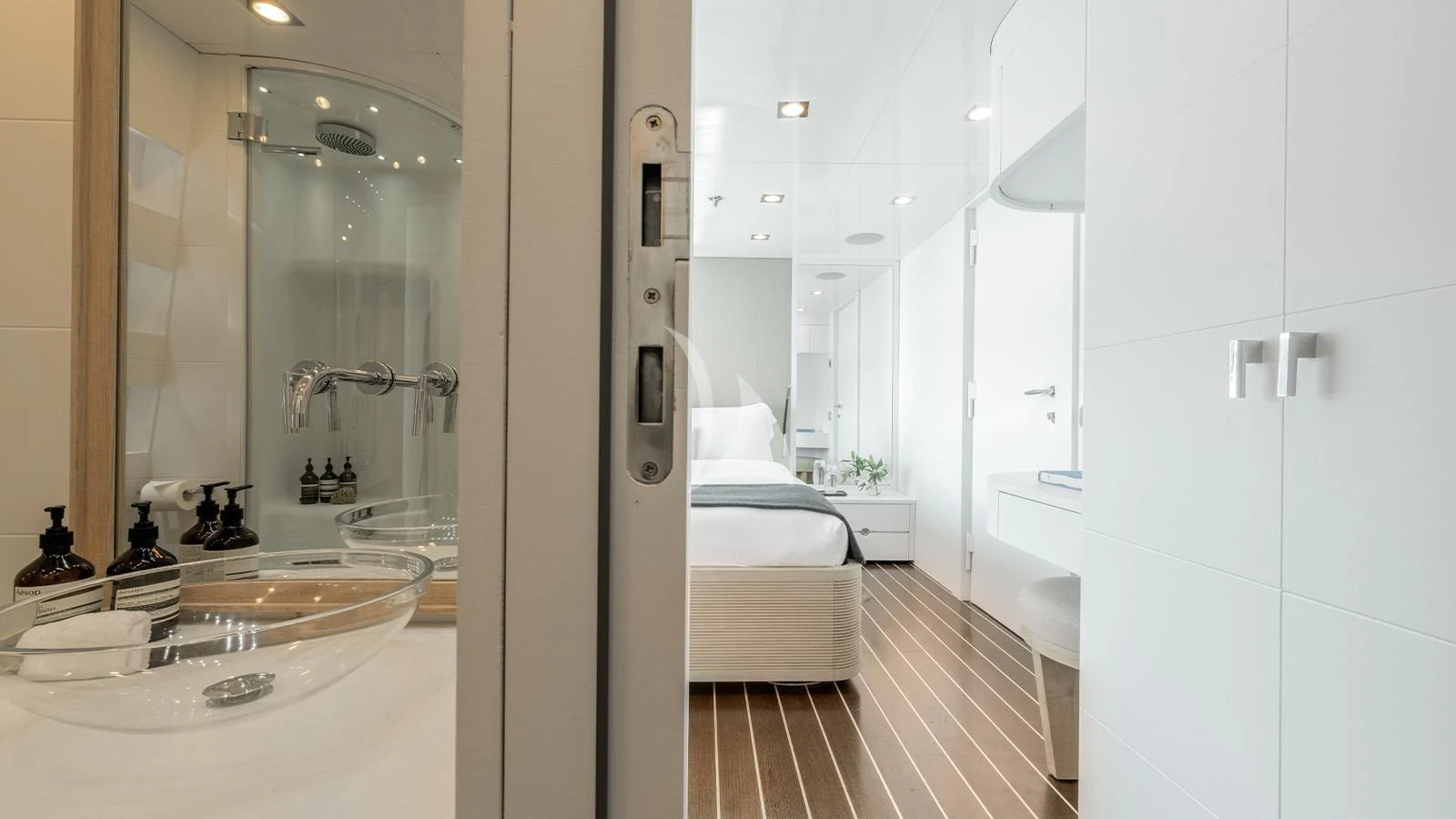 a bathroom with a large mirror aboard ZIA Yacht for Sale