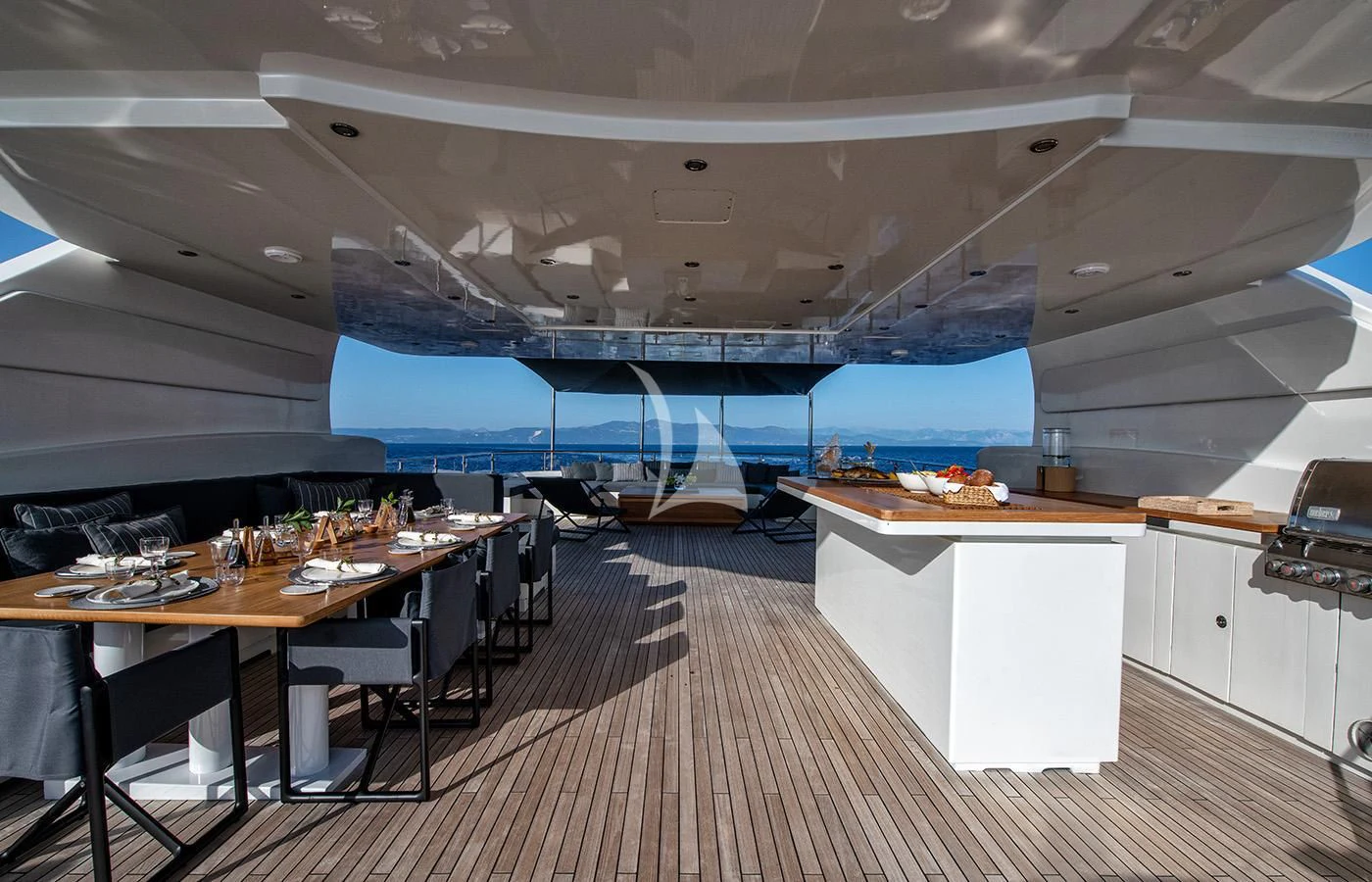 a room with a table and chairs aboard ZIA Yacht for Sale