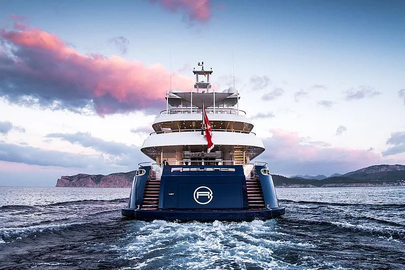 a boat in the water with Thomas Point Shoal Light in the background aboard ZIA Yacht for Sale