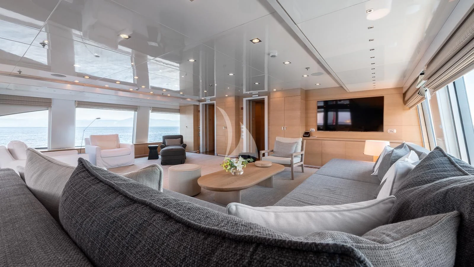 a living room with a couch and a television aboard ZIA Yacht for Sale