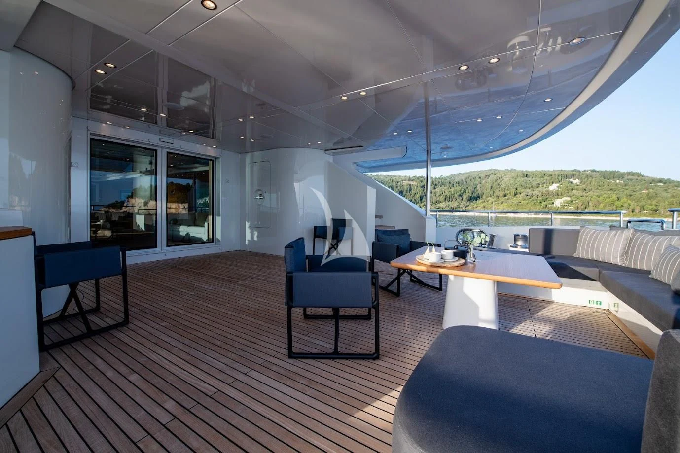 a large room with a table and chairs aboard ZIA Yacht for Sale