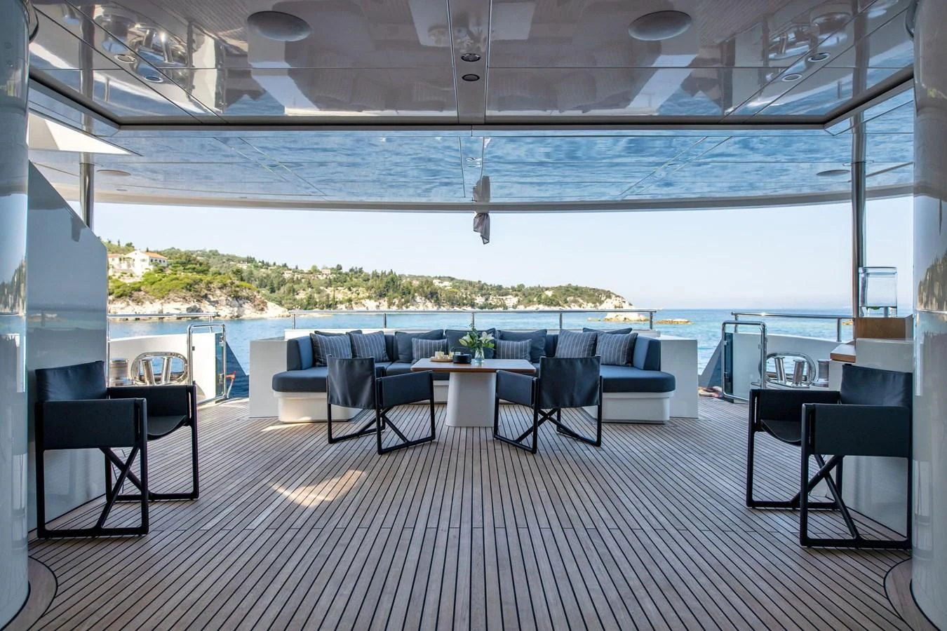 a room with a table and chairs aboard ZIA Yacht for Sale