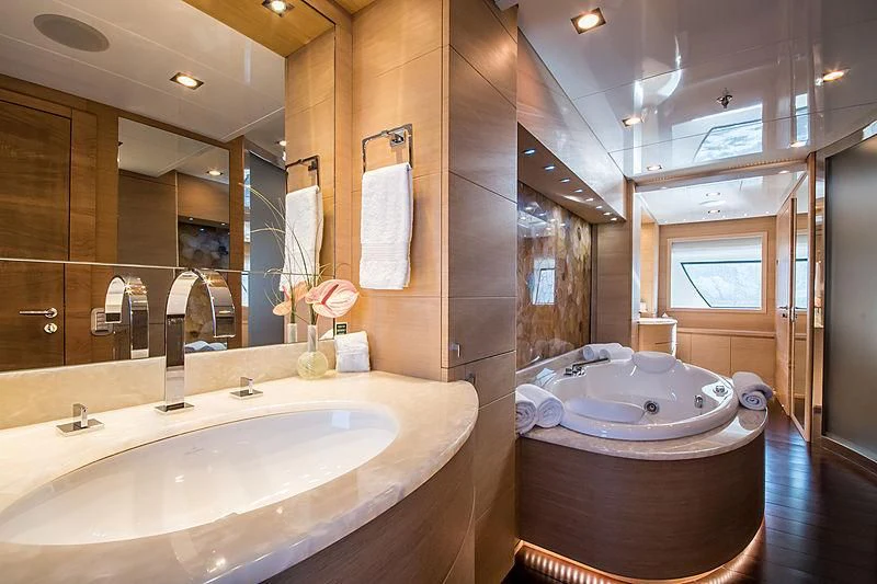 a bathroom with a large tub aboard ZIA Yacht for Sale