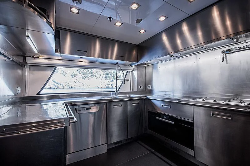 a kitchen with stainless steel appliances aboard ZIA Yacht for Sale