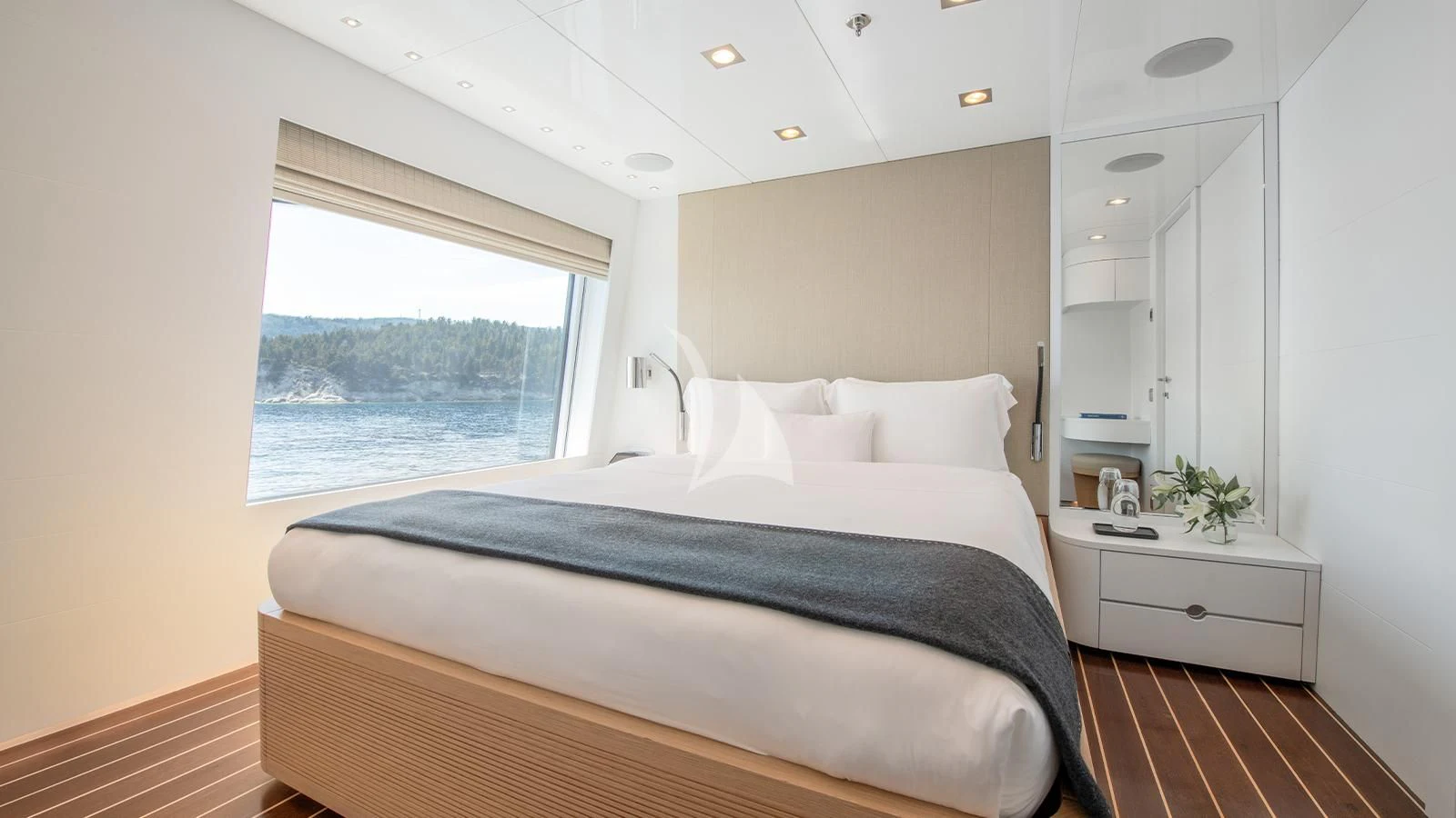a bedroom with a large bed aboard ZIA Yacht for Sale