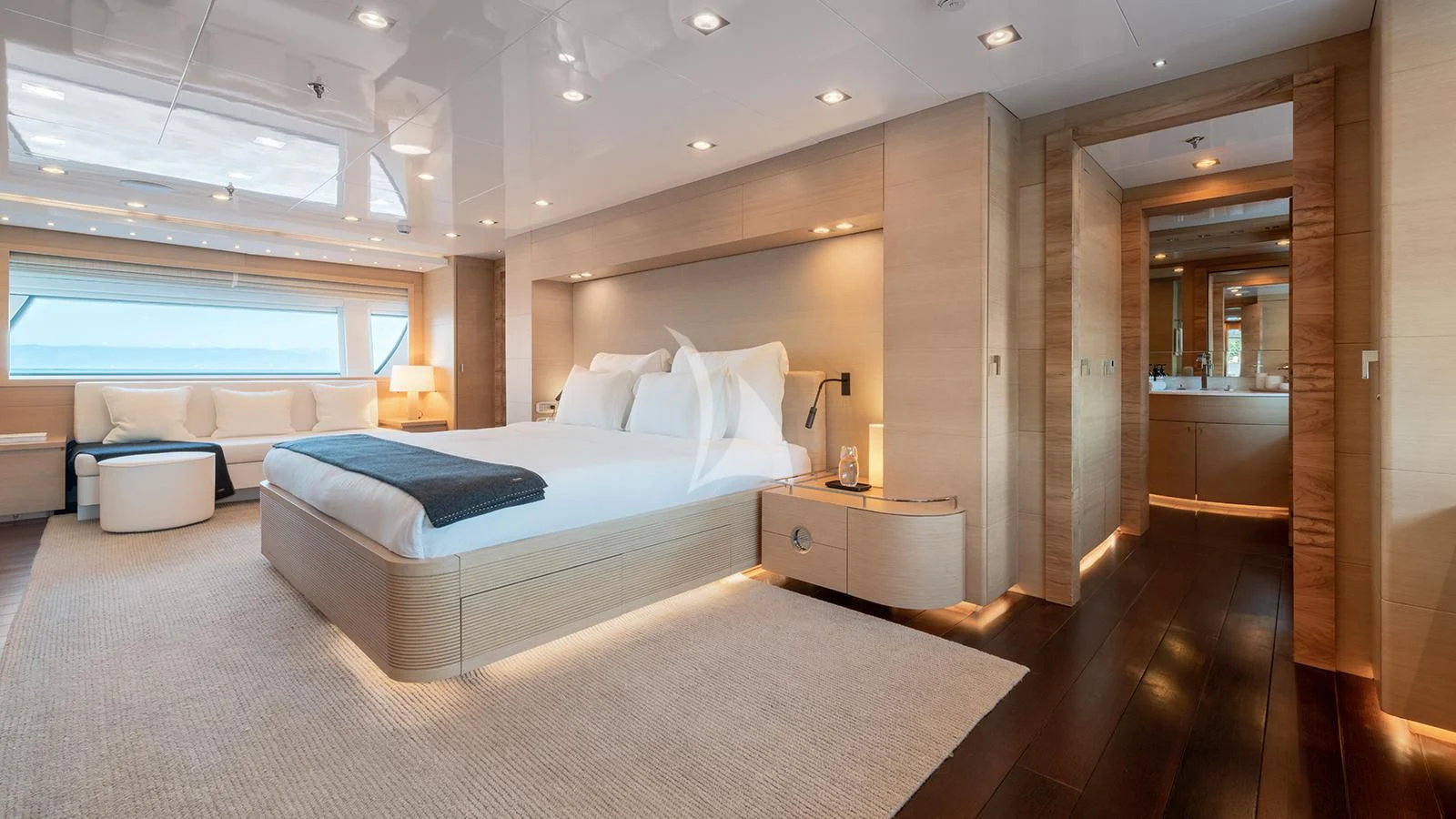 a large bedroom with a large bed aboard ZIA Yacht for Sale