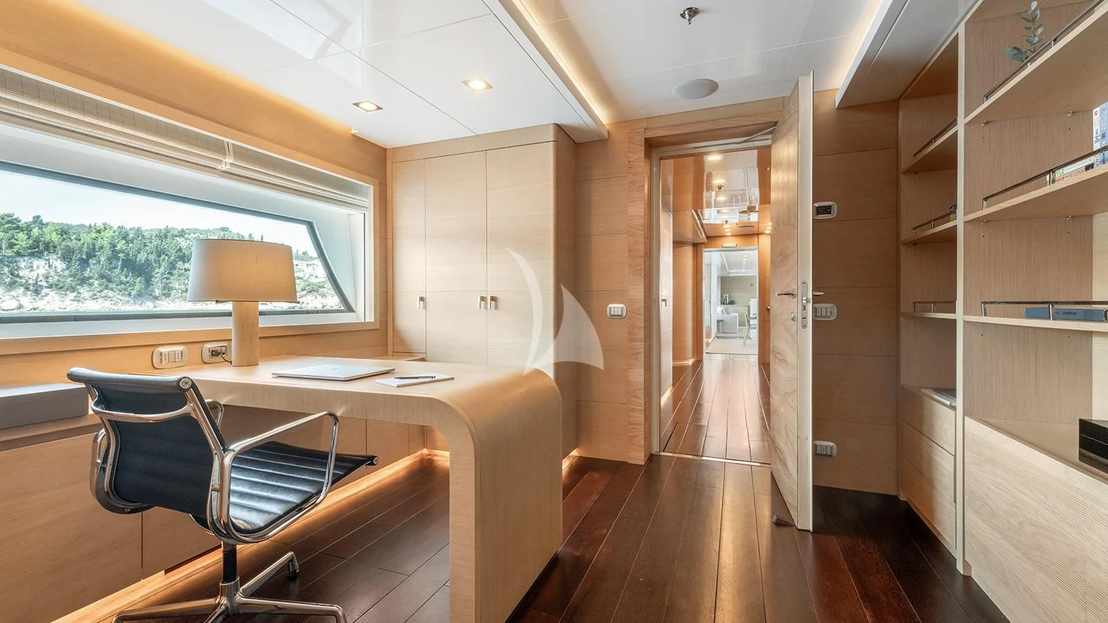 a room with a desk and a bed aboard ZIA Yacht for Sale