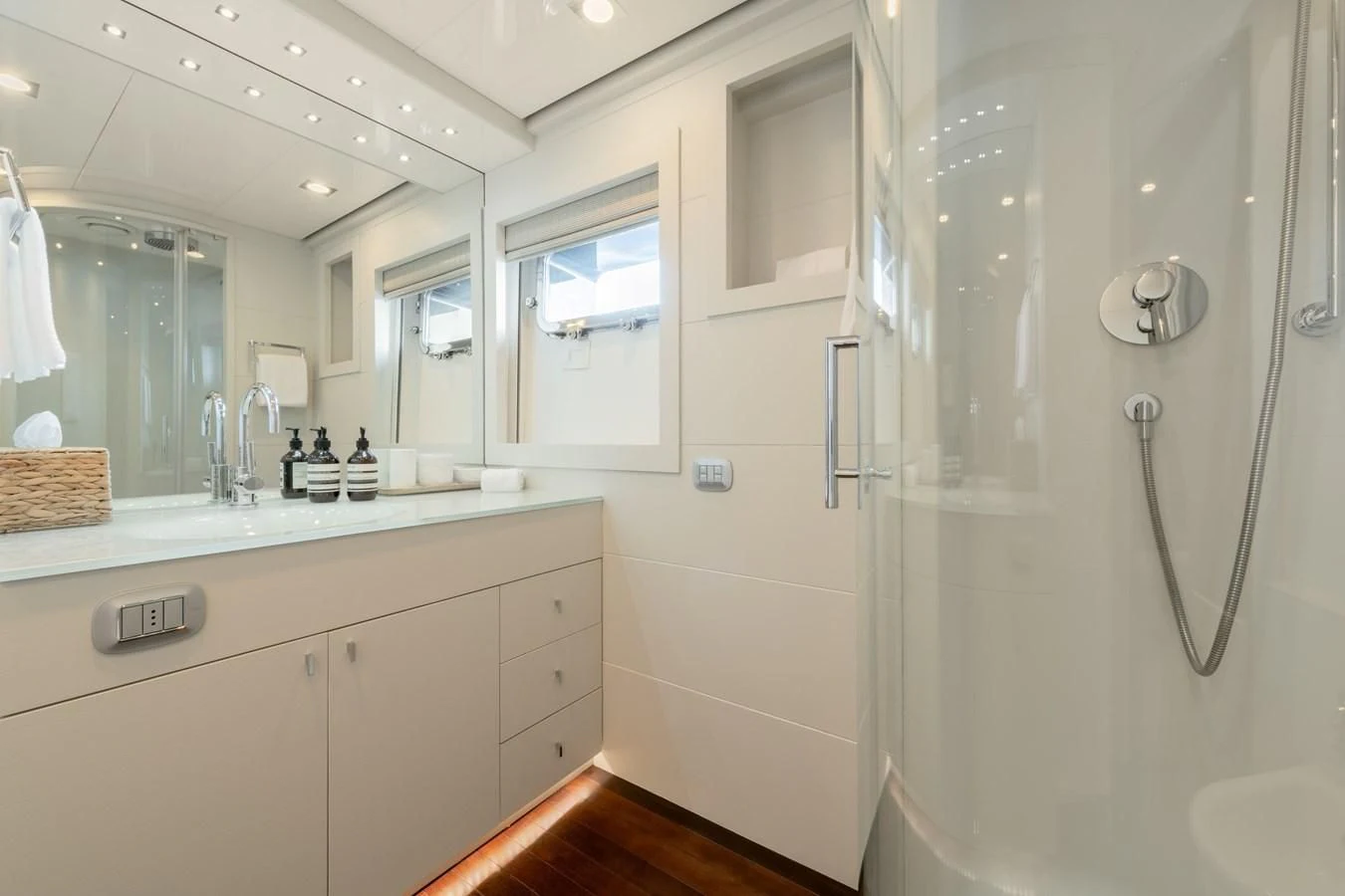 a bathroom with a large mirror aboard ZIA Yacht for Sale