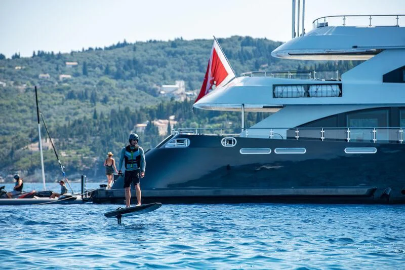 a boat with a flag on it aboard ZIA Yacht for Sale