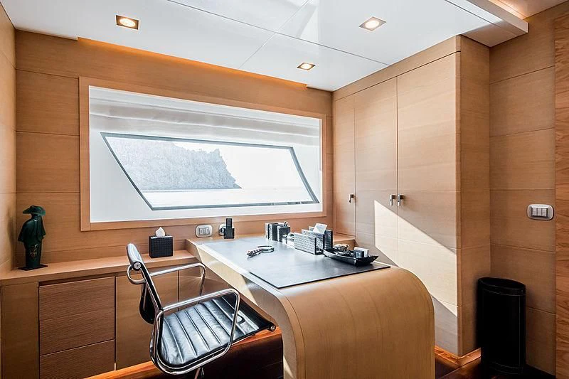 a room with a table and chairs aboard ZIA Yacht for Sale