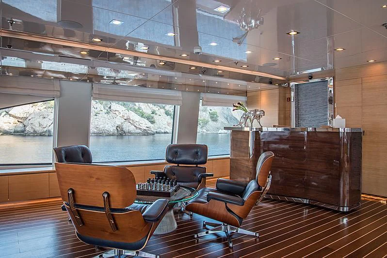 a room with leather furniture aboard ZIA Yacht for Sale