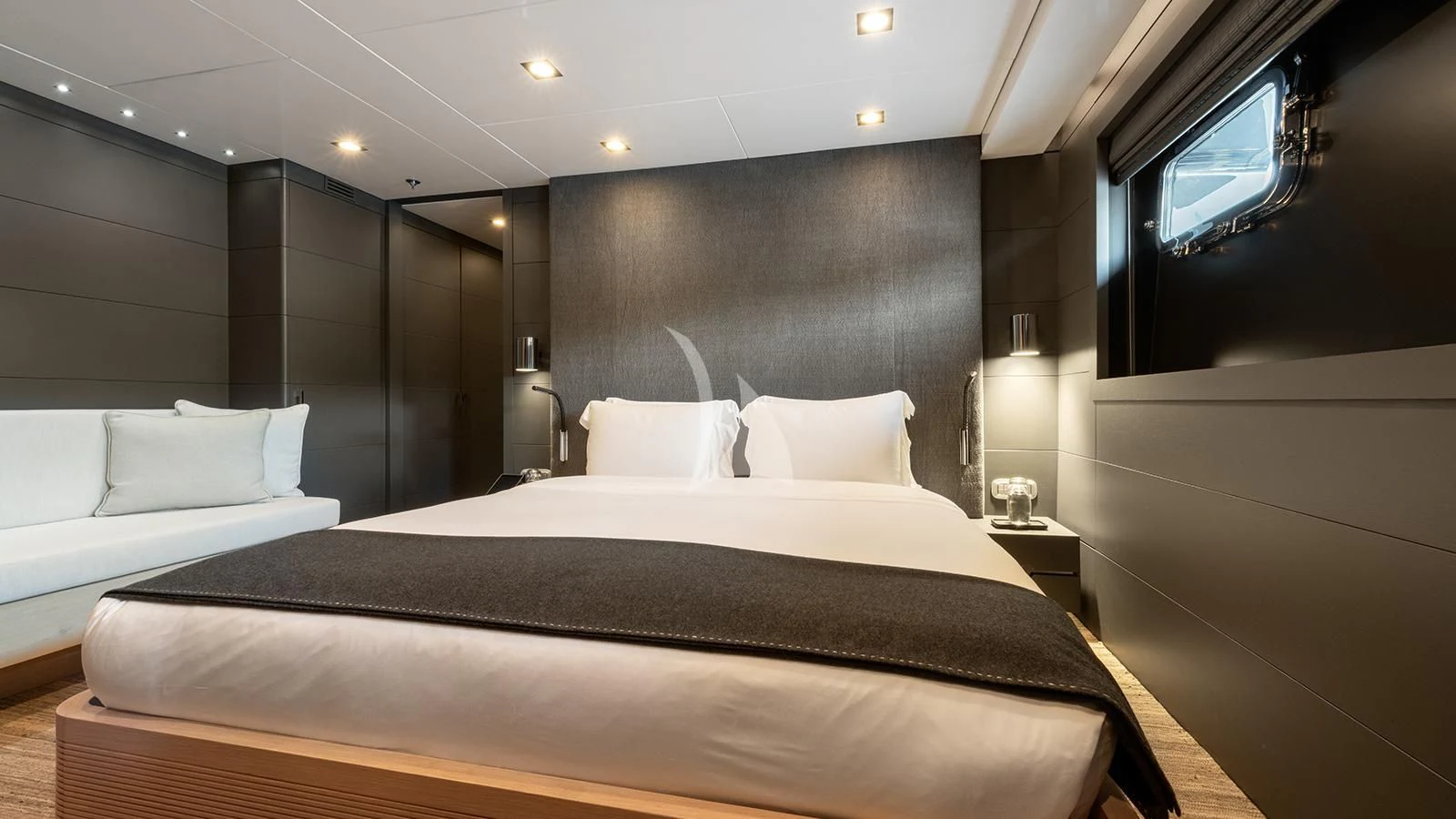 a room with a bed and a tv on the wall aboard ZIA Yacht for Sale