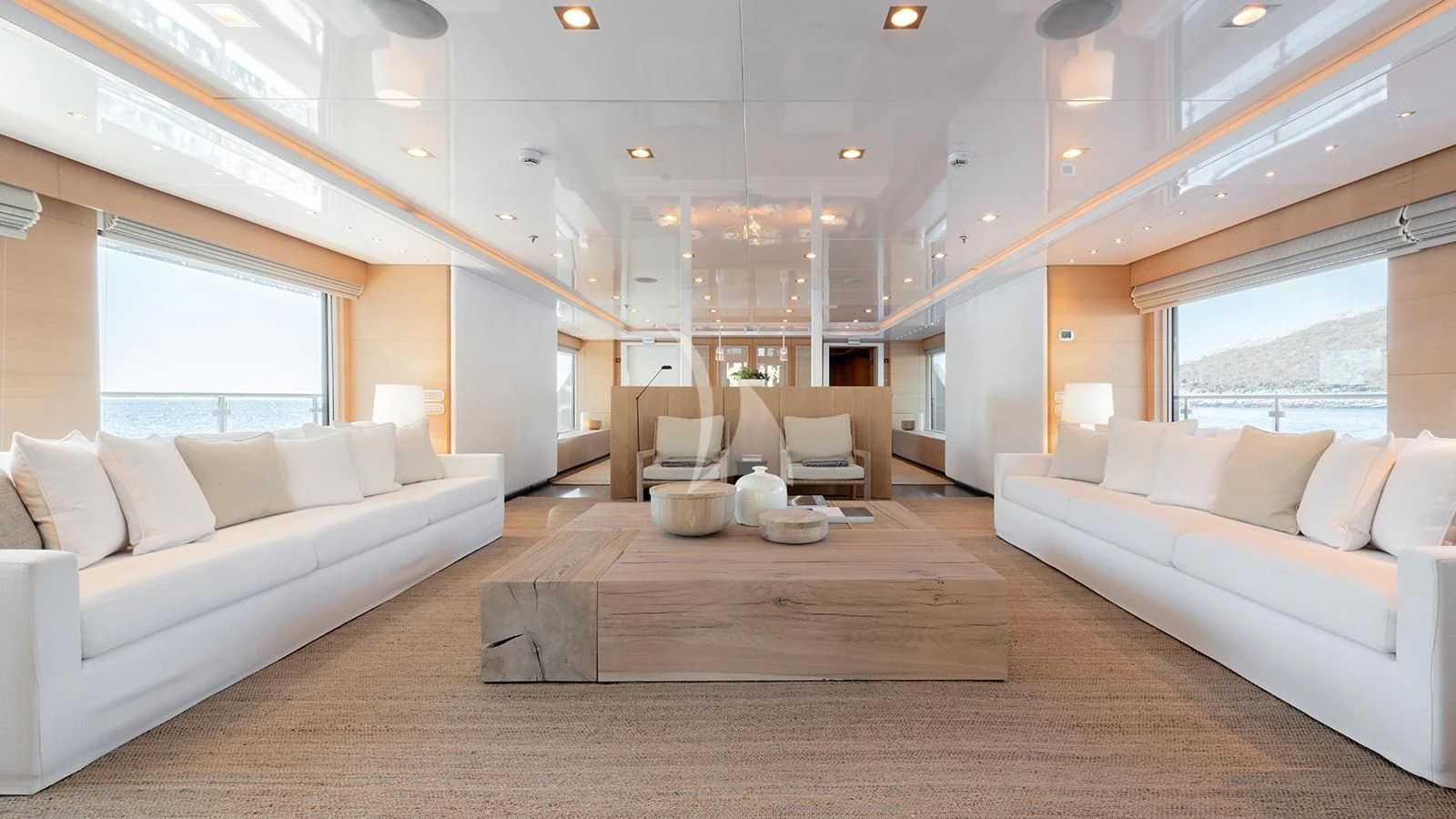 a living room with a couch and a table aboard ZIA Yacht for Sale