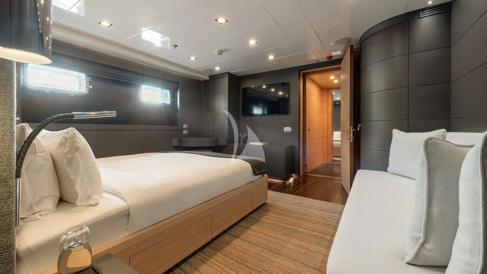 a room with beds and a tv aboard ZIA Yacht for Sale