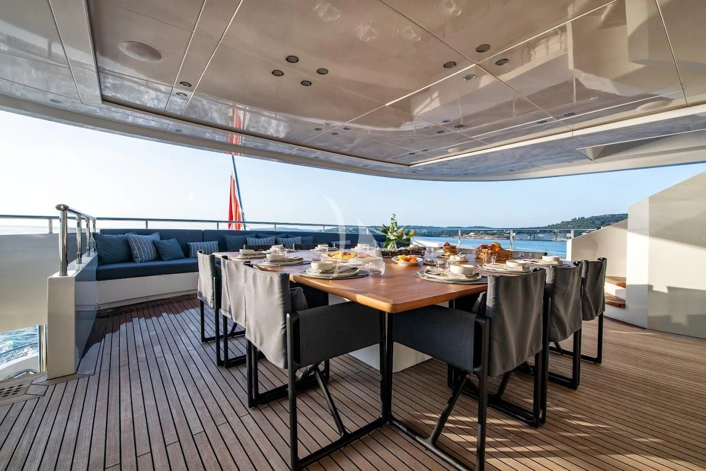 a room with a table and chairs aboard ZIA Yacht for Sale