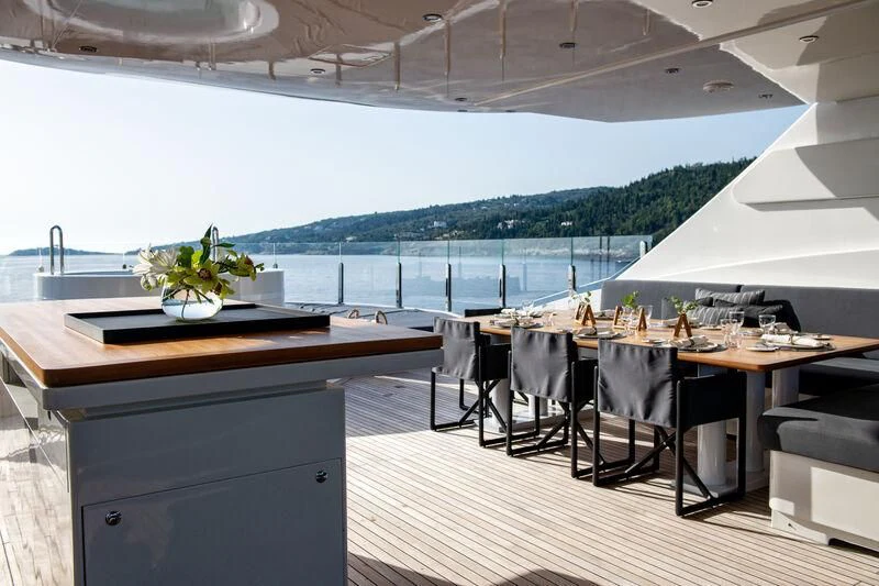 a room with a table and chairs aboard ZIA Yacht for Sale