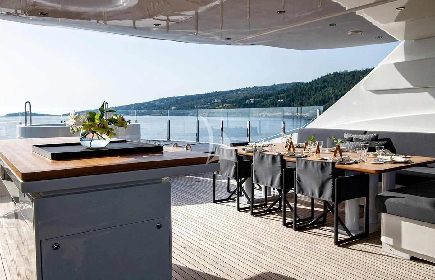 a room with a table and chairs aboard ZIA Yacht for Sale