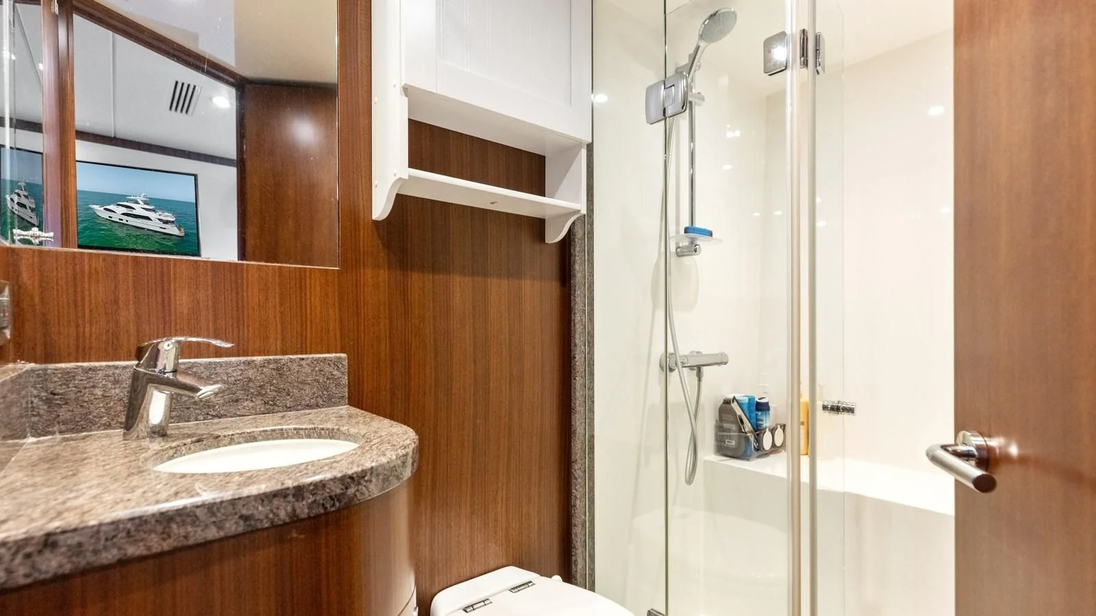 a bathroom with a sink and a shower aboard CLAYMAKER Yacht for Sale
