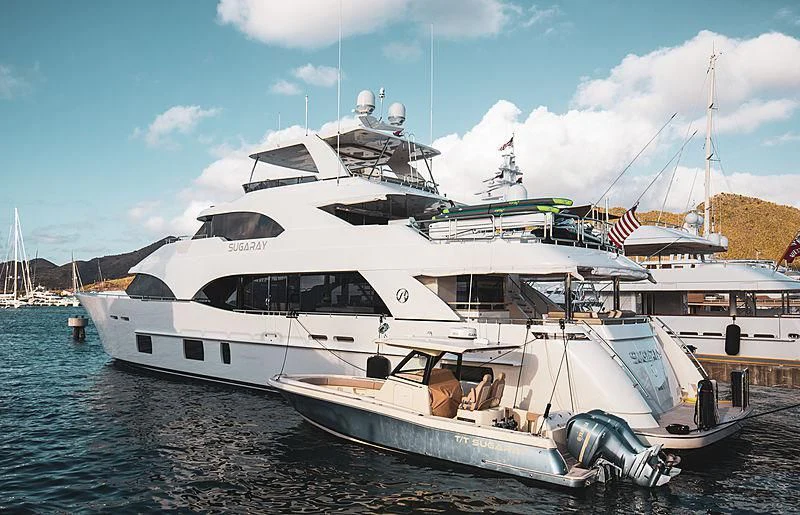a large white yacht docked at a pier aboard CLAYMAKER Yacht for Sale