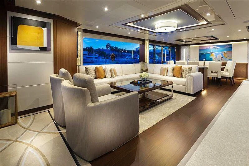a living room with a large screen aboard CLAYMAKER Yacht for Sale