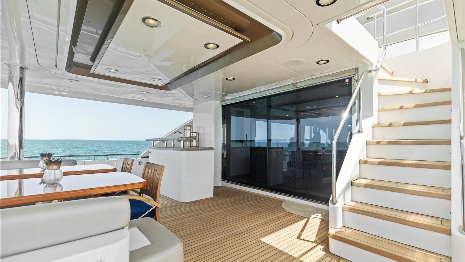 a modern looking room with a large open door aboard CLAYMAKER Yacht for Sale