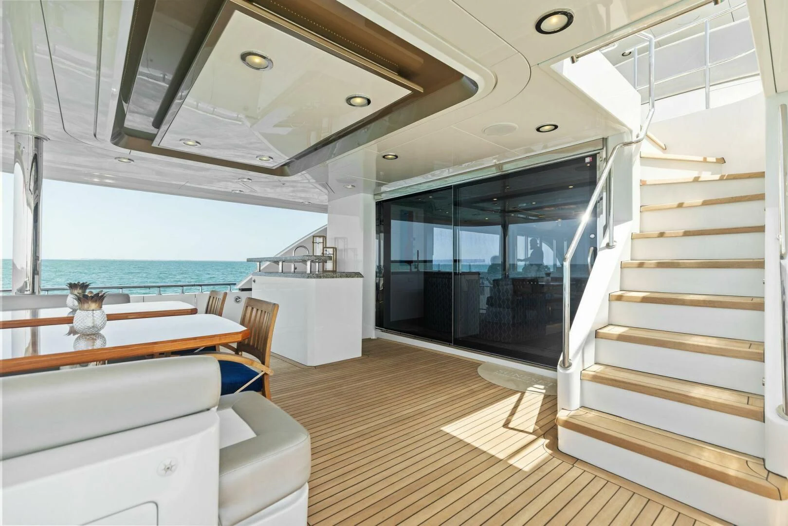 a modern looking room with a large open door aboard CLAYMAKER Yacht for Sale