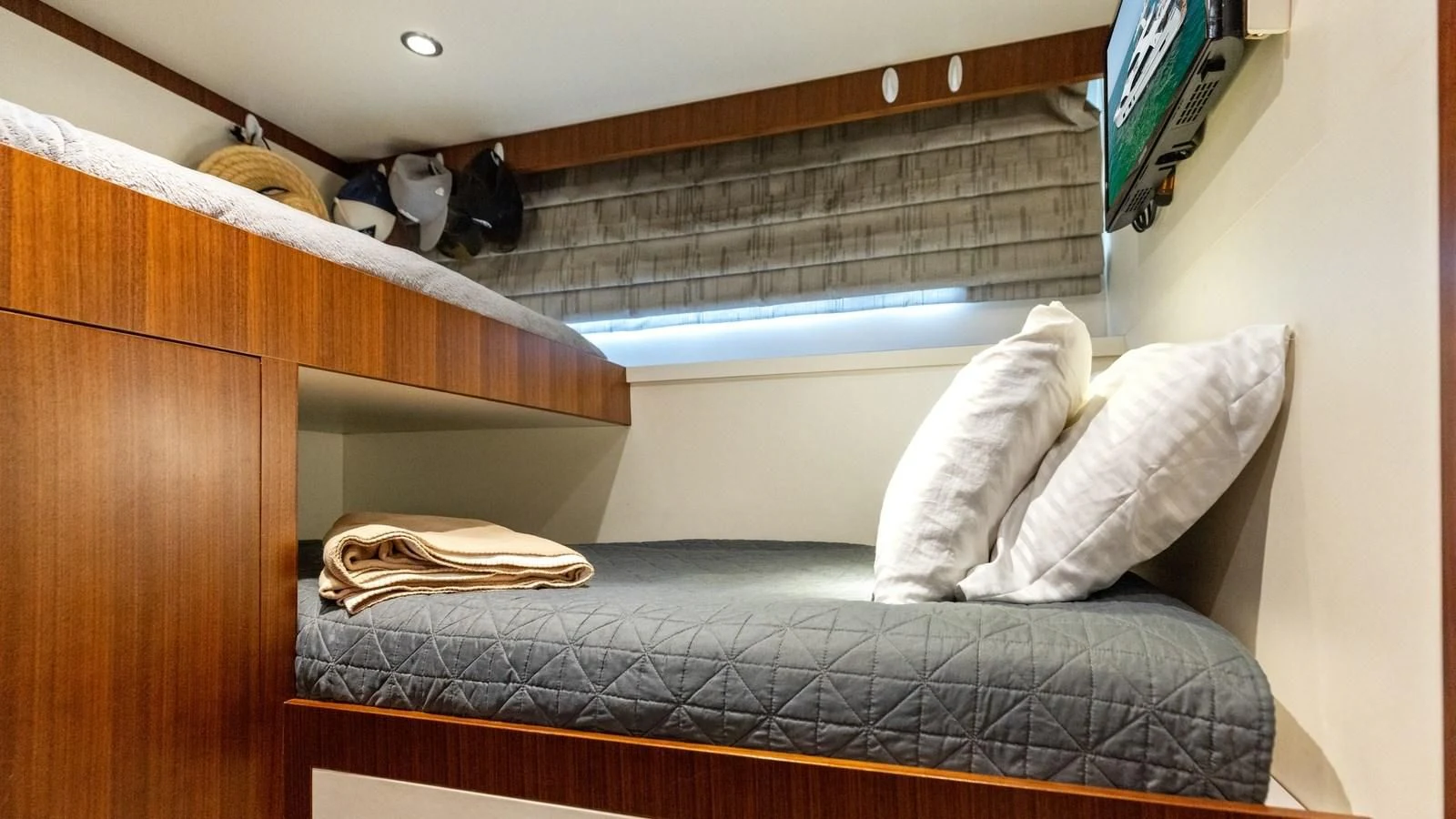 a bed with white sheets aboard CLAYMAKER Yacht for Sale